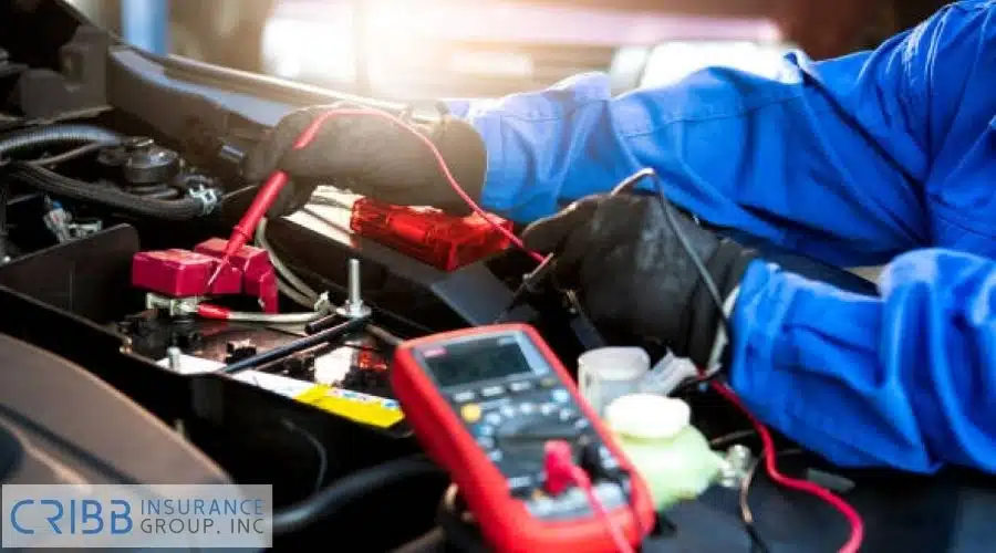 EV mechanic inspecting electric vehicle battery